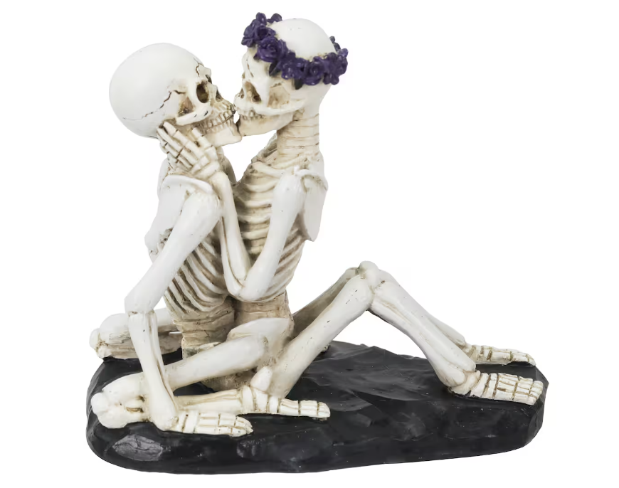 skeleton figurine featuring two skeletons making love